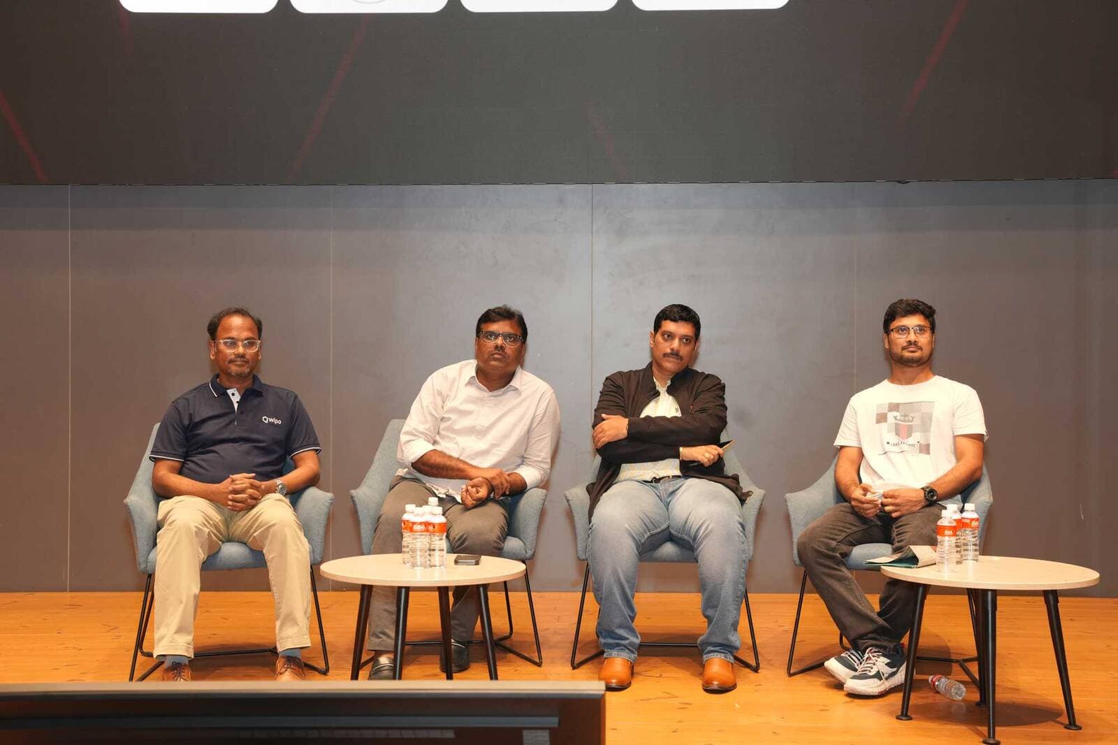 The HacXLerate jury seated on stage